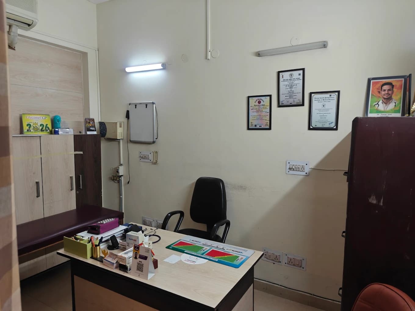 Dr. Pawan Goel's consulting room with his certificates on the wall