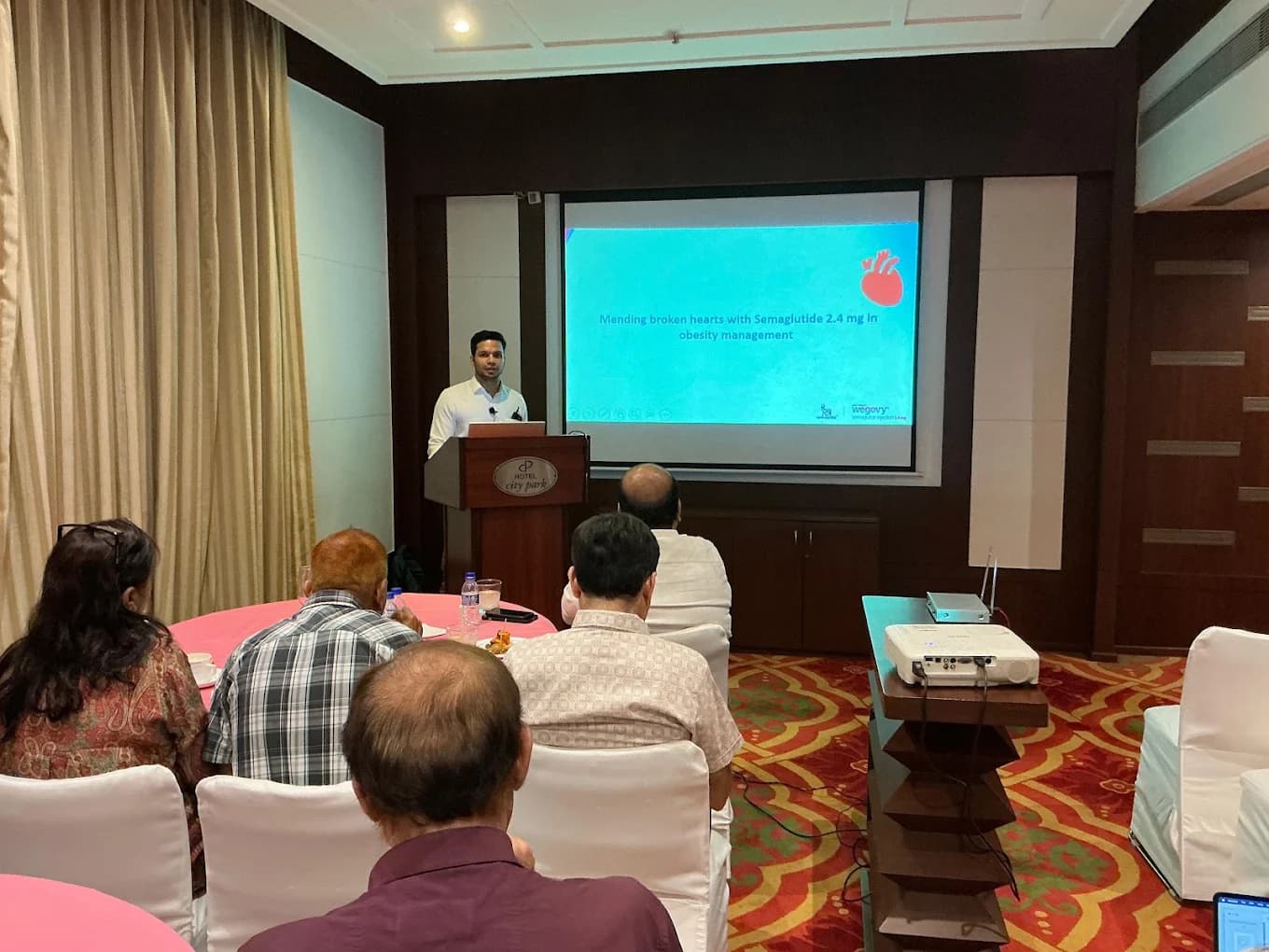 Dr. Pawan Goel presenting on obesity management at a conference